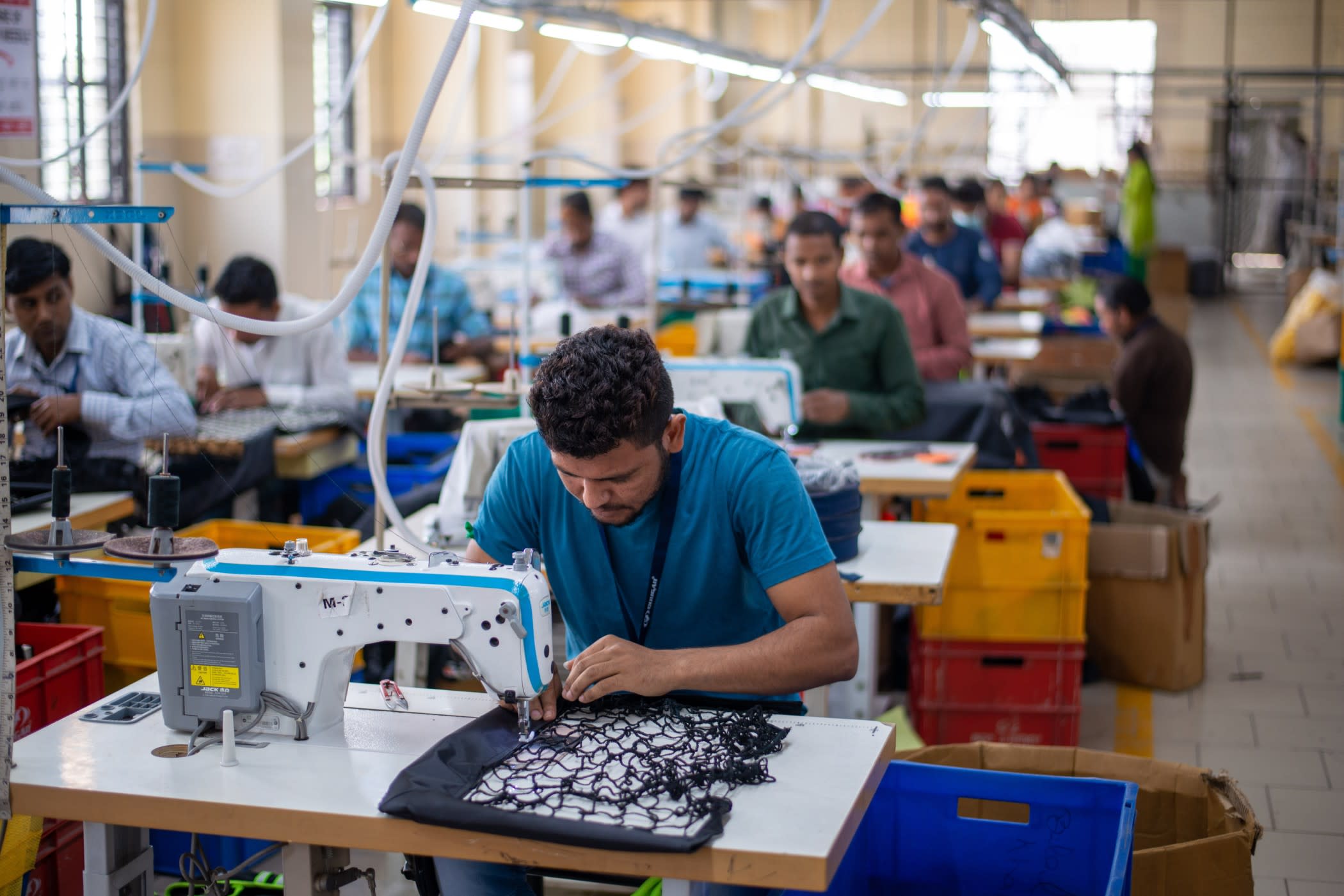 Integrated garment manufacturing process in a single production facility